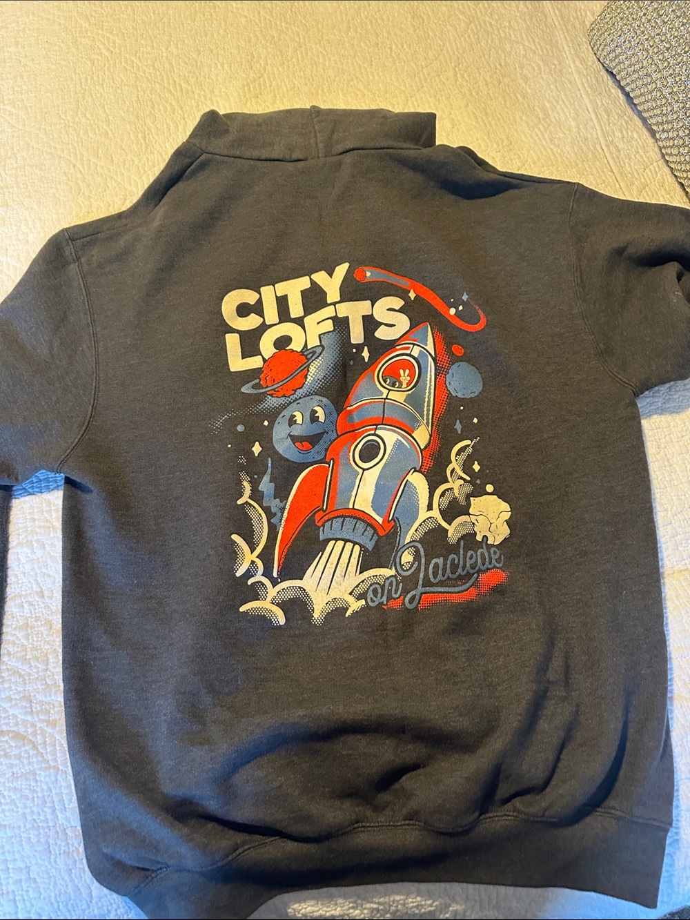 Champion Black Pullover Hoodie with Retro Red and Cream Rocket Graphic